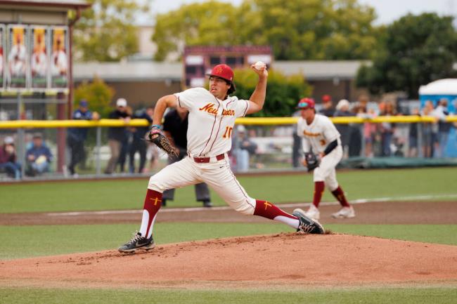 Cardinal Newman’s Mason Lerma pitches against Campolindo during the May 27 North Coast Section title game at Cardinal Newman High School. (Abraham Fuentes / For The Press Democrat)