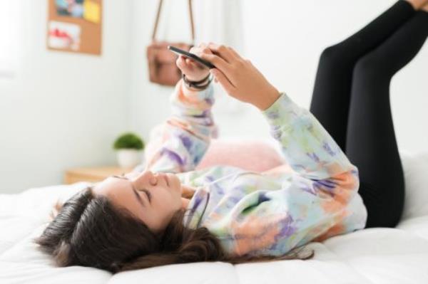 woman sitting in front of her laptop - things to do when bored