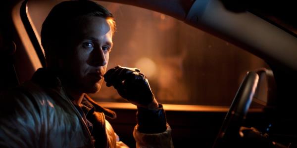 Ryan Gosling sitting in a car in Drive