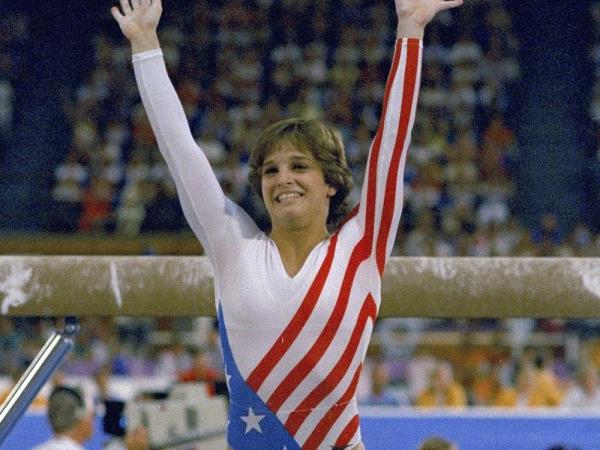 FILE: Mary Lou Retton reacts to applause after her performance at the Summer Olympics in Los Angeles on Aug. 3, 1984. Retton, 55, is in intensive care in a Texas hospital fighting a rare form of pneumonia, according to her daughter McKenna Kelley.