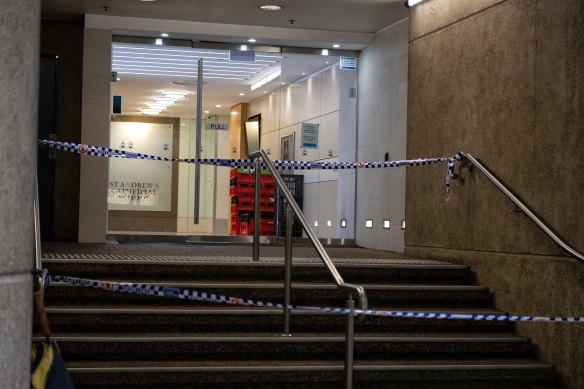 Police tape surrounds one of the school’s entrances on Thursday.